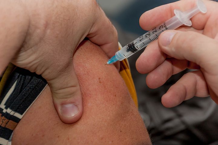 person getting a flu vaccine